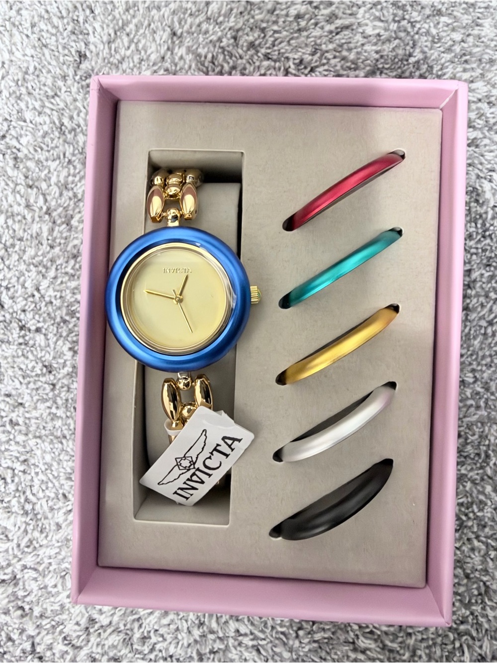 Invicta Women’s Gold Bangle Watch with Interchangeable Blue Bezel